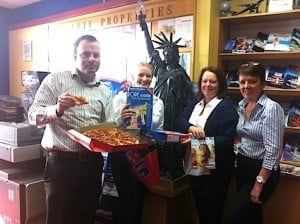Liberty Travel’s team tuck into their 1STS pizza on the final Facebook Friday
