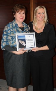 Clare Dunne -The Travel Broker receives her award from Nicky Tempest-Mitchell.