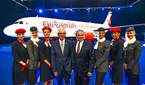 Wolfgang Prock-Schauer, Chief Executive, airberlin (centre left) and James Hogan, President and Chief Executive, Etihad Airways (centre right), celebrate the unveiling of a new airberlin-Etihad Airways joint liveried aircraft in Berlin