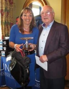 Tanya Airey receiving the ITTN/TIGS Golfer of the year trophy from Ian Bloomfield.