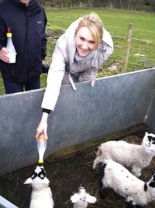 Kersti feeds the lambs at Leault Farm