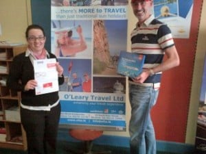 Stephen Davitt,Emirates presents Corina Kenny of O'Leary Travel in Wexford with her prize.