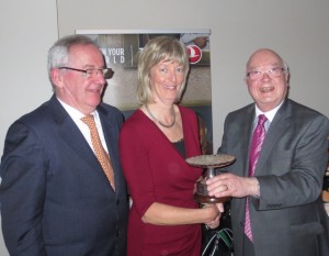 Pat Dawson ,Captain TIGS joins with winner of the ITTN/Tigs Golfer of the Year,Audrey Headon as she receives her prize from Ian Bloomfield.