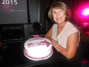 Admiring the TCI 10th anniversary cake baked by Donna Olohan is Mary Foyle, winner of the Best Phenix Award with 76% of her bookings made on the Phenix system