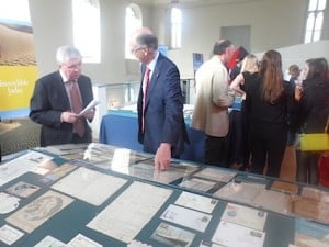 Tom MacSweeney, who opened the exhibition, is shown the exhibits by George Barter