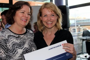 Teresa  Walsh from AF?KLM presents two tickets anywhere on Air France network to Lynn Halford from Trailfinders.