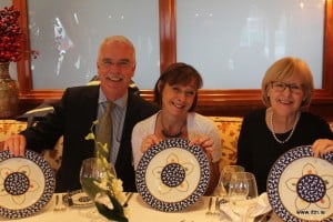 John Galligan,Carly Perkins and Mary O'Sullivan admiring the Bvvvv show plates in the Pinnacle Grill onboard MS Prinsendam