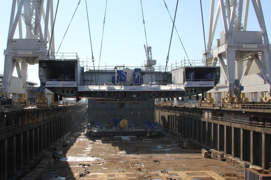 The keel of Silver Muse is lowered into the construction dock in Genoa.
