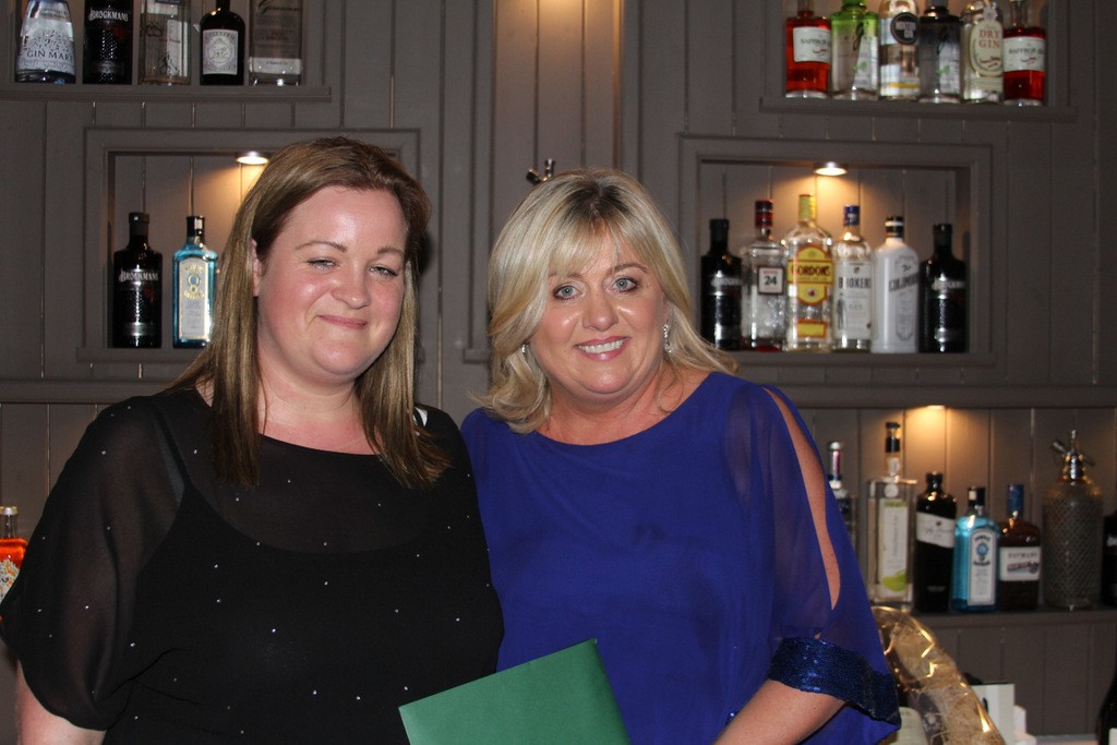Carol Anne O'Neill receiving a voucher for dinner for two in Castle Leslie from Naomi Byrne.