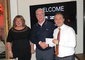 John Galligan, John Galligan Travel (centre), receives his prize from Amanda Middler, Silversea, and Hasan Mutlu, Turkish Airlines
