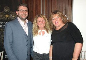 Fionna Dobbyn, Classic Resorts (centre), receives her prize from Luke Clarke and Amanda Middler, Silversea