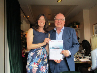 Charlotte Brenner presents voucher for cruise on TUI Explorer to Ian Bloomfield, ITTN