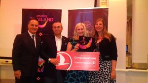 Holiday prize winner Linda Millar, Bryan Somers Travel, receives her prize in Belfast