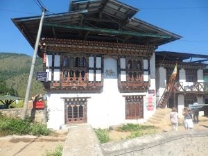 Typical Bhutanese house with phallus wall decoration