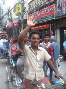 High-five between passing rickshaws