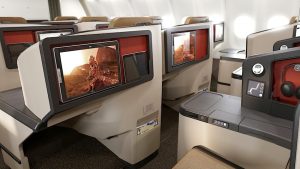 Business Class seats have a 45" pitch and 15" touchscreen