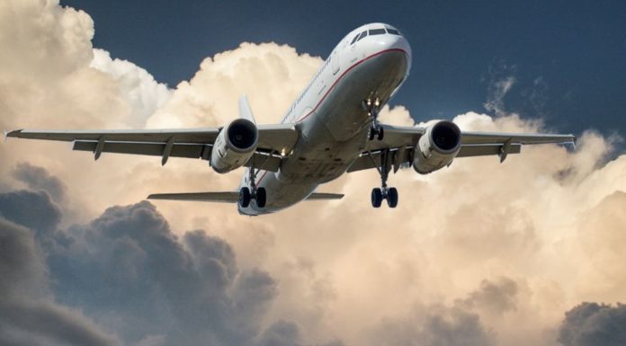 Mobile Phone Usage Will Be Allowed On Europe Flights in 2023 A flight in progress - a plane flying through blue skies and clouds