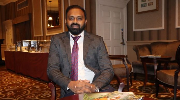Kerala comes calling – ITTN interviews Prem Krishnan Addl. Director General – Tourism Prem Krishnan, Kerala Tourism, seated with coffee table books on the state in front of him. He is wearing a suit, tie and is bearded