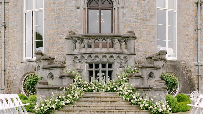 The outside of Markee Castle which is a winner at Gold Awards adorned with floral pieces