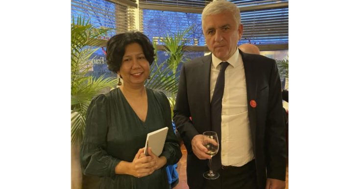 ITTN Meets the President, Normandy Region – Spotlight on Norman-Irish Links Prerna Shah of ITTN in a green dress with Hervé Morin, President of Normandy region