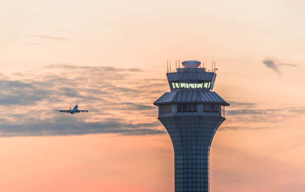 IATA Concerned Over Air Traffic Control Performance in Europe and US Airport traffic control tower at sunset