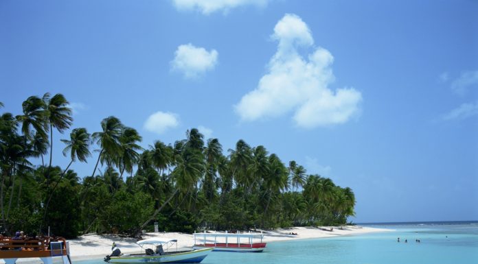 Supplier Spotlight: Caribbean Dreaming with Virgin Atlantic Beach in Tobago in the Caribbean with turquoise water and fishing boats